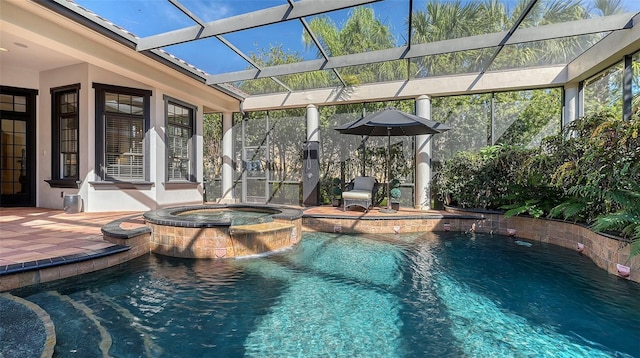 view of swimming pool with a lanai, a patio area, and an in ground hot tub