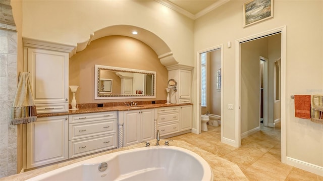 bathroom with vanity, a bathtub, a bidet, toilet, and ornamental molding