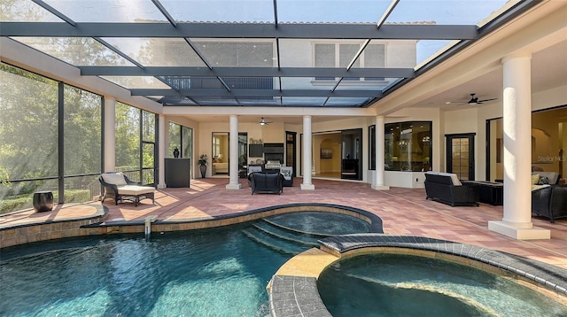 view of pool with an in ground hot tub, ceiling fan, and a patio area