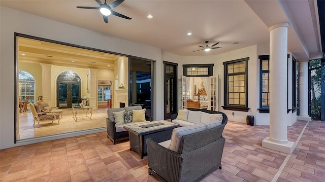 view of patio / terrace with outdoor lounge area, ceiling fan, and french doors