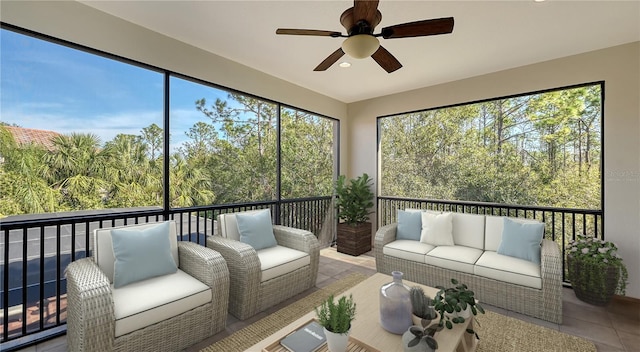 sunroom / solarium with ceiling fan and a healthy amount of sunlight