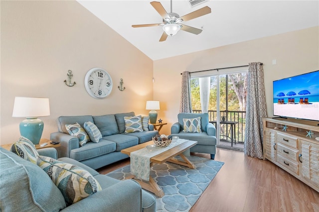 living room featuring high vaulted ceiling, light hardwood / wood-style flooring, and ceiling fan