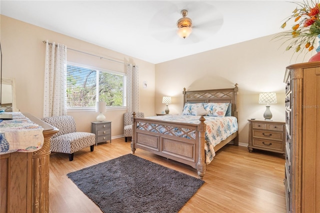 bedroom featuring light hardwood / wood-style flooring and ceiling fan