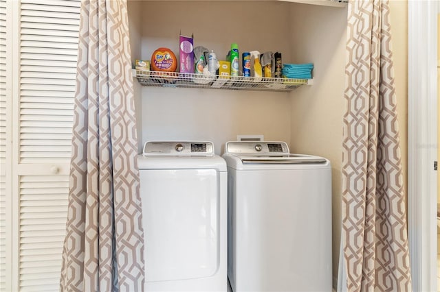 laundry area with washing machine and clothes dryer