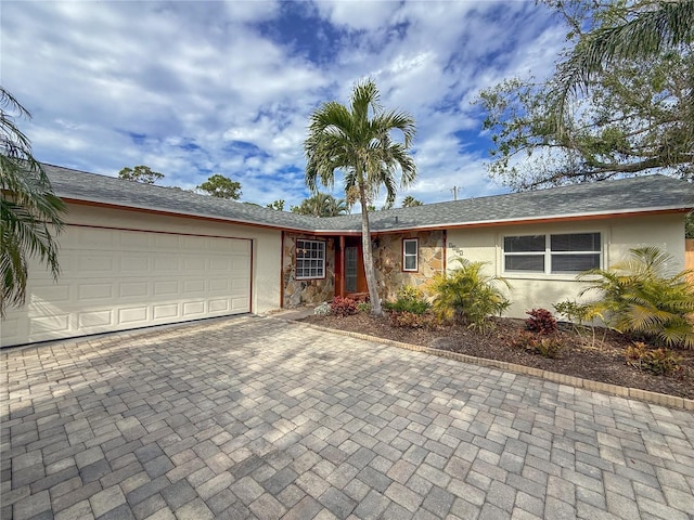 ranch-style home with a garage