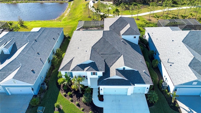 birds eye view of property with a water view