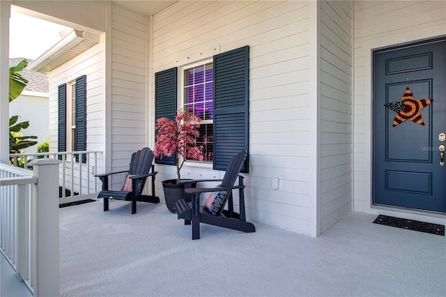 view of exterior entry with a porch