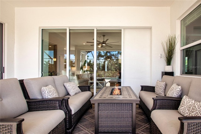 view of patio / terrace featuring an outdoor living space with a fire pit