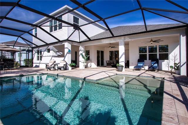 view of pool with a patio area, ceiling fan, and a lanai