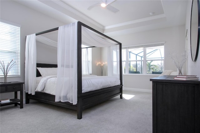 bedroom with ceiling fan, light colored carpet, and ornamental molding