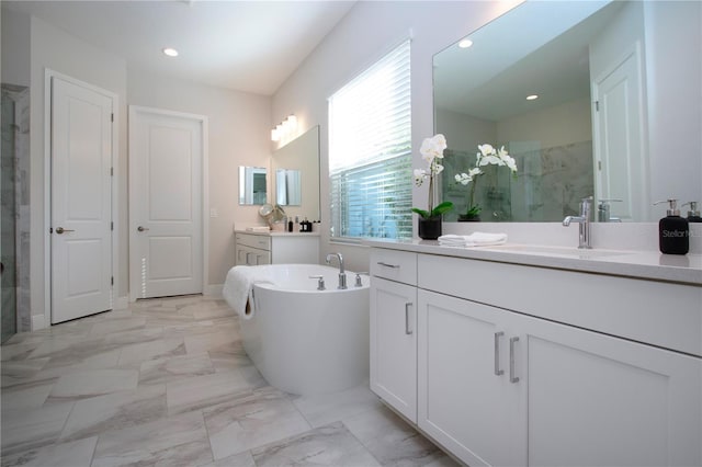 bathroom featuring separate shower and tub and vanity