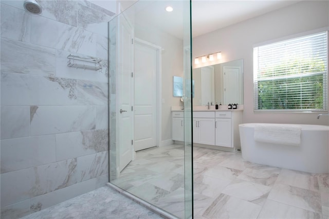 bathroom featuring plus walk in shower and vanity