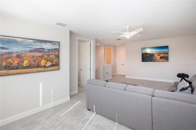 living room featuring light colored carpet and ceiling fan