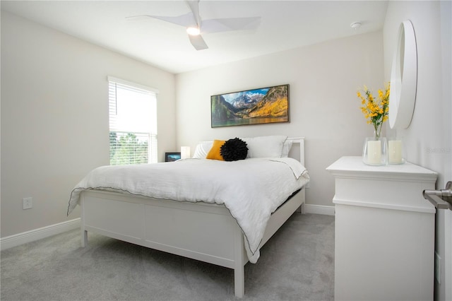 bedroom with light colored carpet and ceiling fan