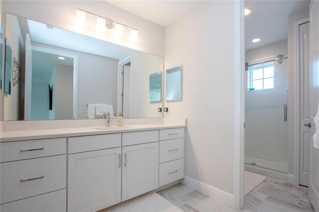 bathroom with vanity and an enclosed shower