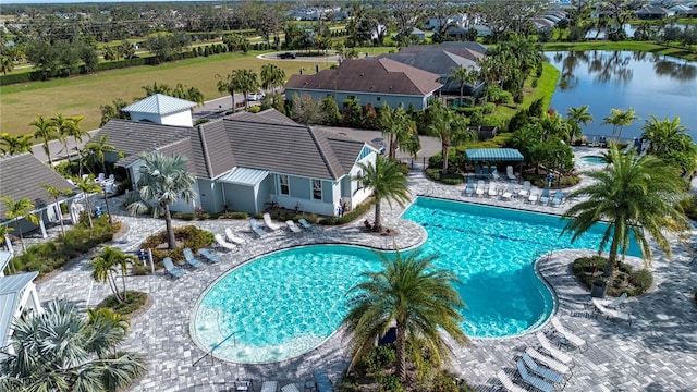 view of swimming pool featuring a water view