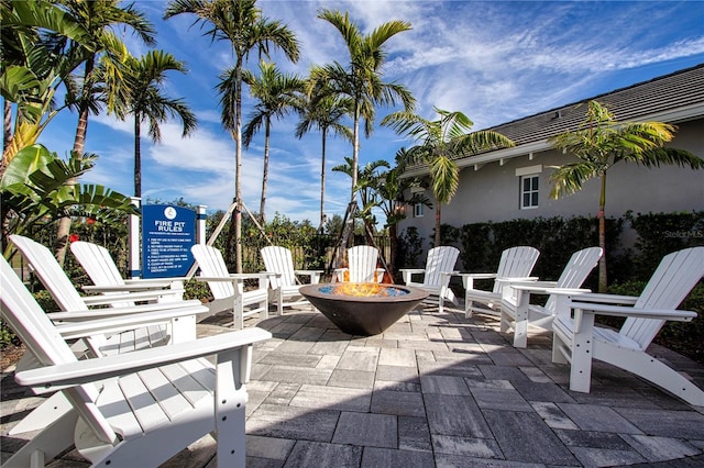 view of patio / terrace featuring an outdoor fire pit