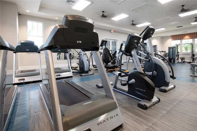 exercise room with ceiling fan