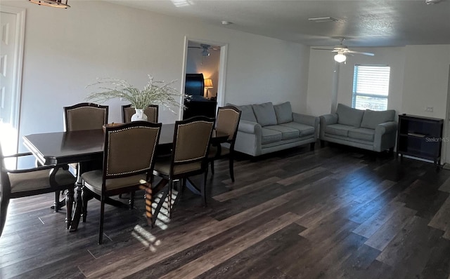 dining area with dark hardwood / wood-style flooring and ceiling fan