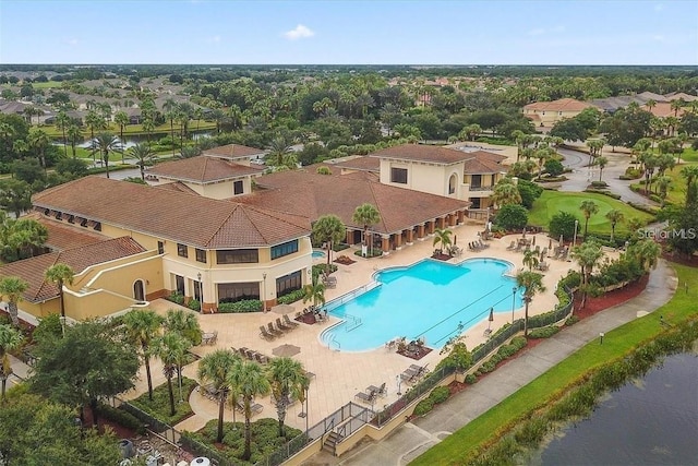 birds eye view of property with a water view