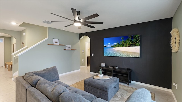 tiled cinema room with ceiling fan