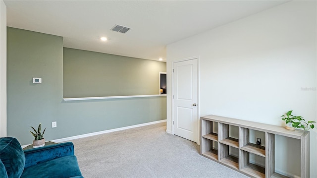 sitting room with light carpet