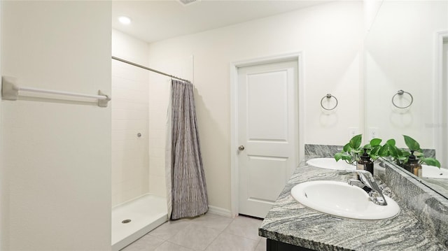 bathroom with tile patterned floors, vanity, and a shower with shower curtain