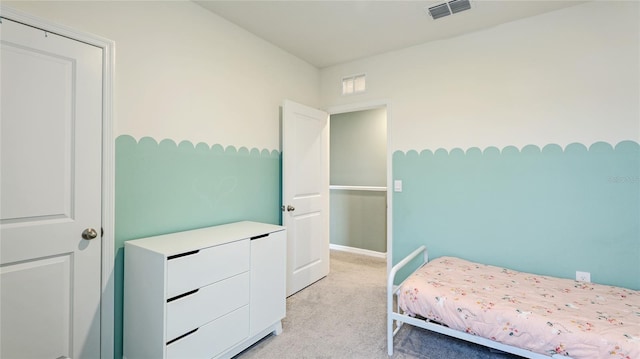 bedroom with light carpet