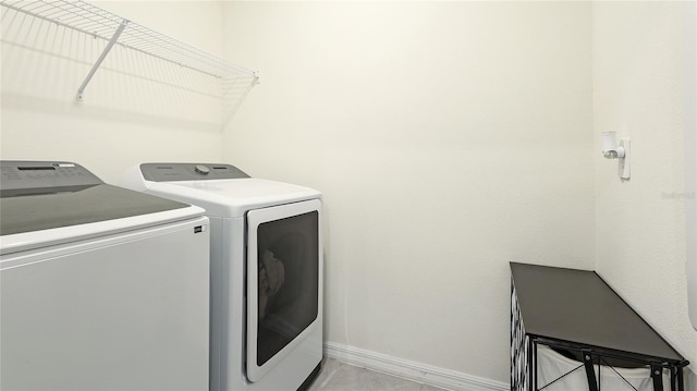 laundry area featuring washing machine and clothes dryer