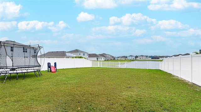 view of yard with a trampoline