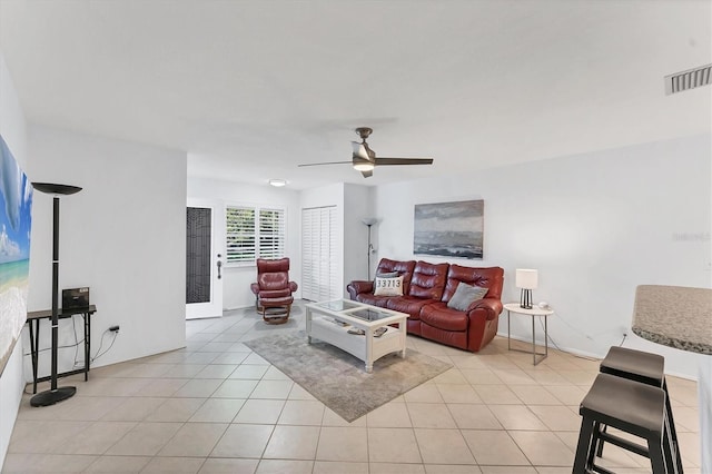 living room with light tile patterned floors and ceiling fan