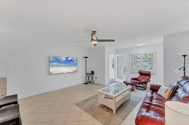 tiled living room with ceiling fan