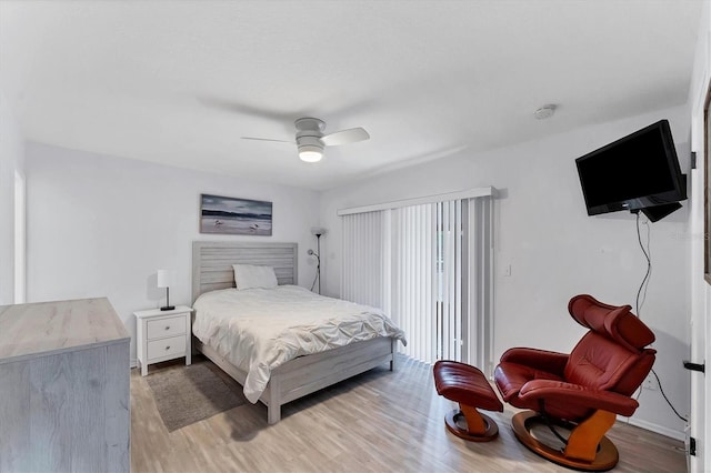 bedroom with light hardwood / wood-style floors and ceiling fan