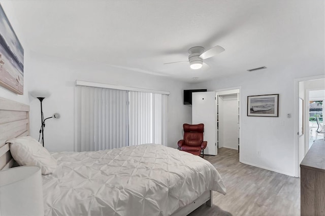 bedroom featuring ceiling fan and light hardwood / wood-style flooring