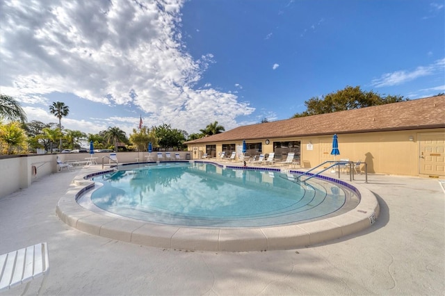 view of swimming pool with a patio