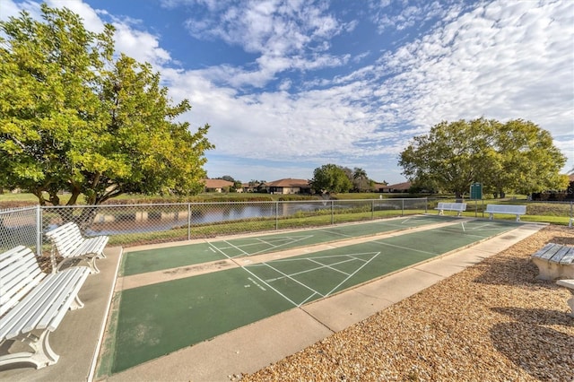 surrounding community featuring a water view