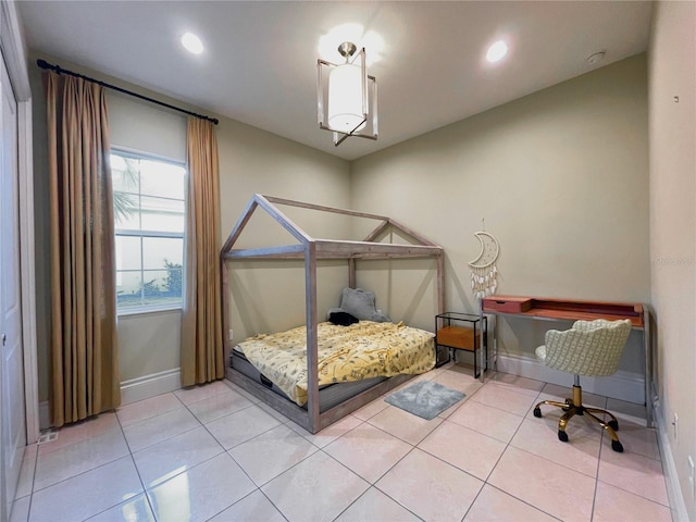 bedroom with light tile patterned floors