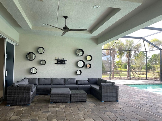 view of patio / terrace with outdoor lounge area and glass enclosure