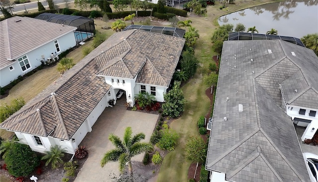 birds eye view of property with a water view