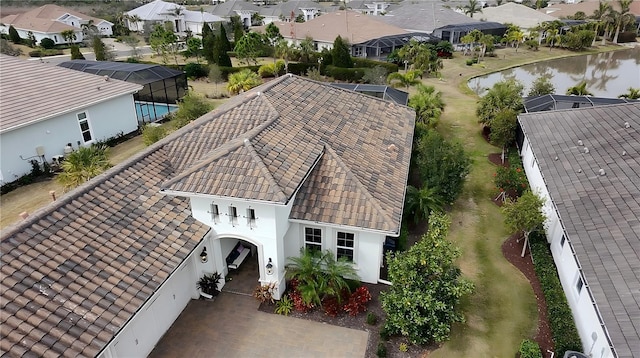 bird's eye view with a residential view and a water view