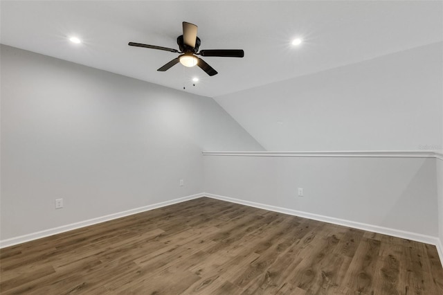 additional living space with dark wood-style flooring, recessed lighting, and baseboards