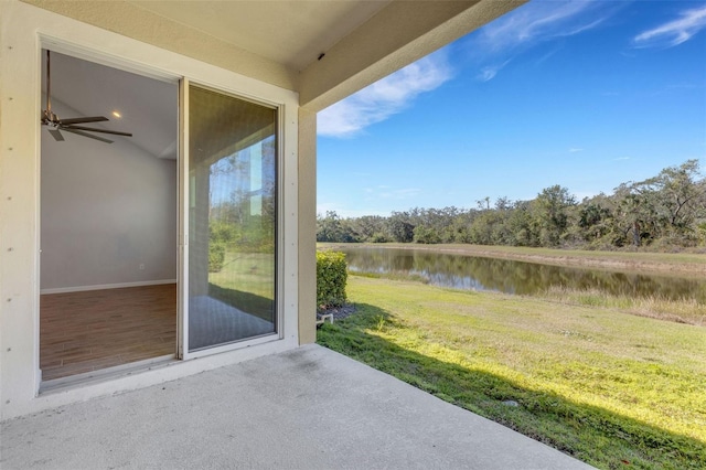 view of patio with a water view