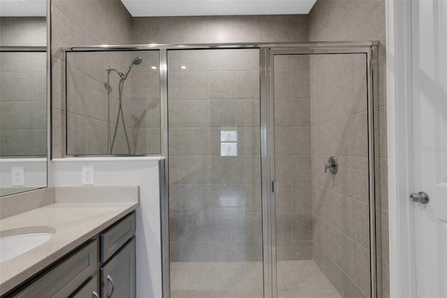 bathroom featuring a stall shower and vanity