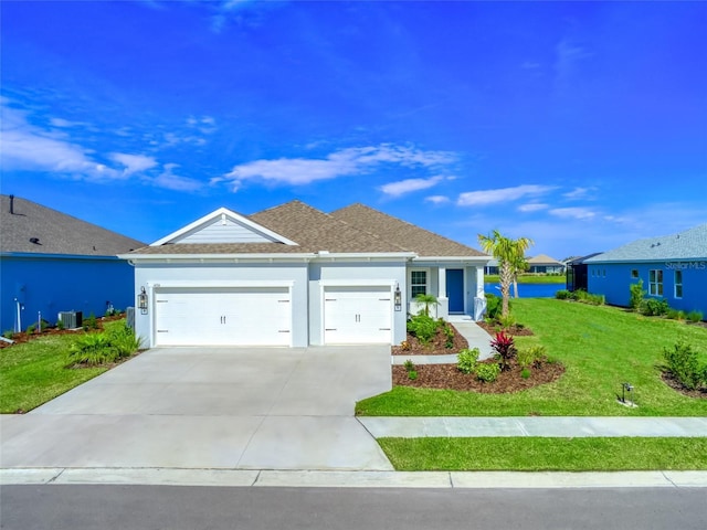 ranch-style house with a garage, a front yard, driveway, and stucco siding