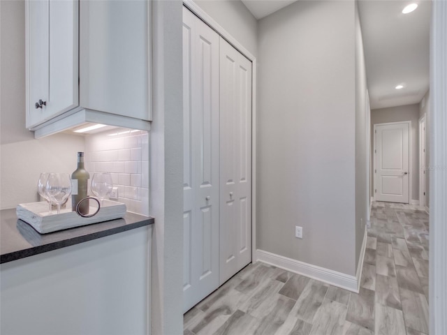 interior space with recessed lighting, light wood-style flooring, and baseboards