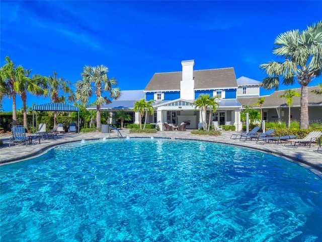 community pool with a patio