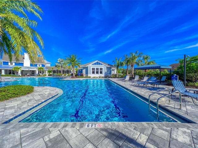 community pool featuring a patio and a gazebo