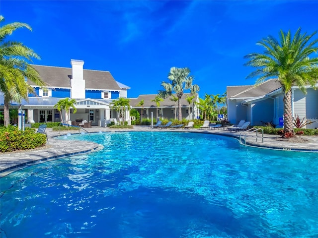 community pool with a patio