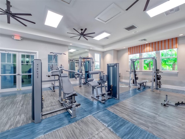 gym featuring french doors, visible vents, and baseboards