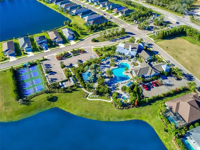 bird's eye view featuring a water view and a residential view